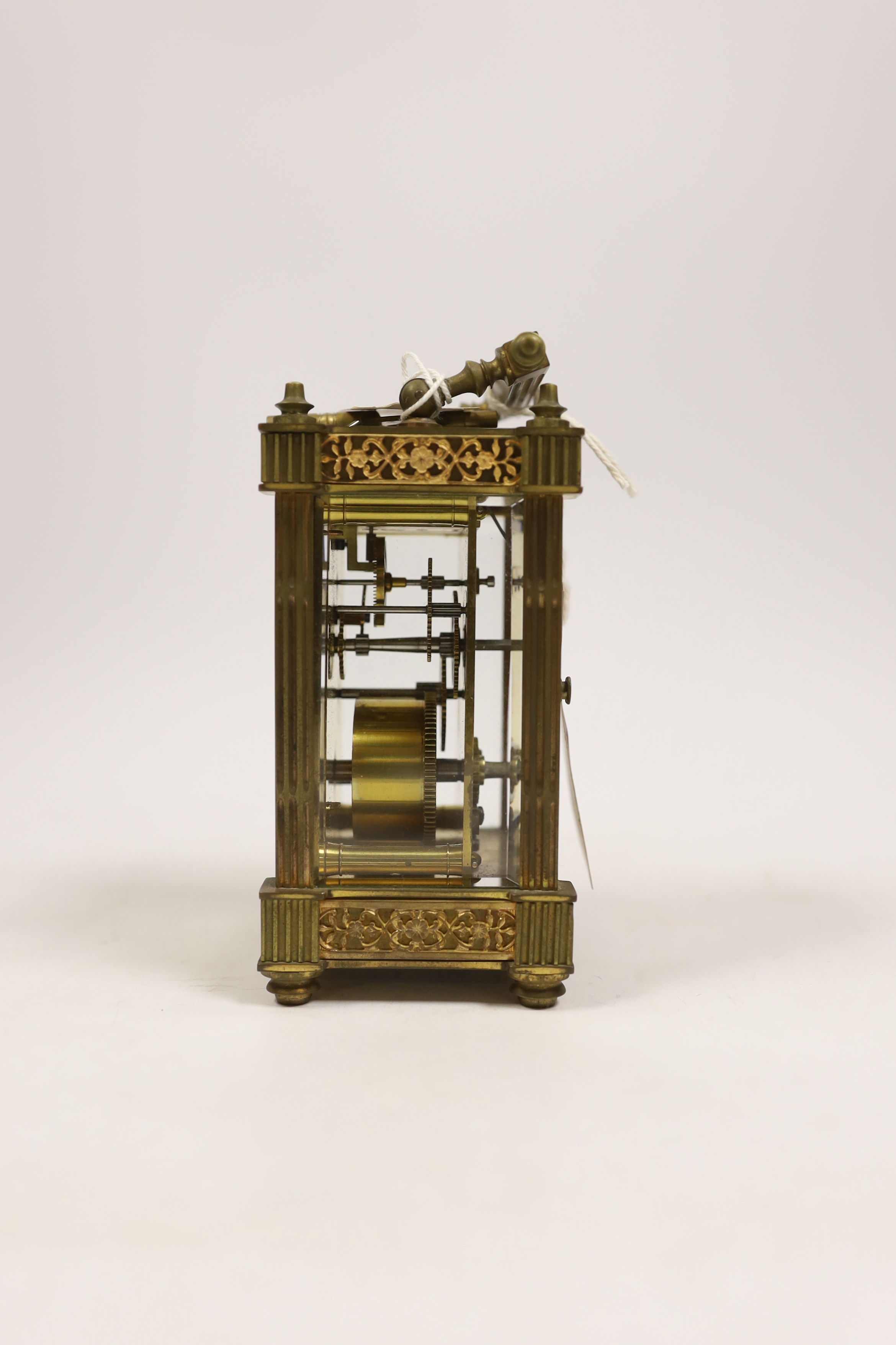 A brass carriage timepiece with square fluted columns, 13cm